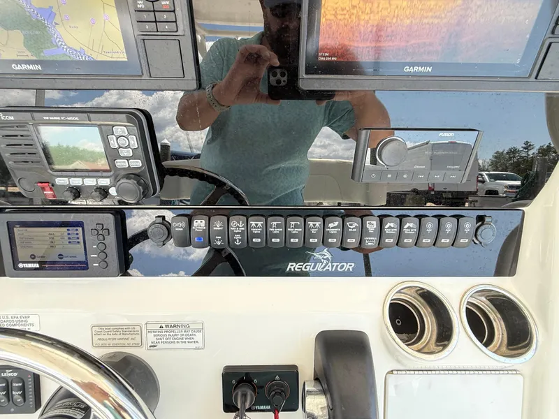 Slide: The Image of Control panel of a 2018 Regulator 23 boat with Garmin navigation systems. - 29
