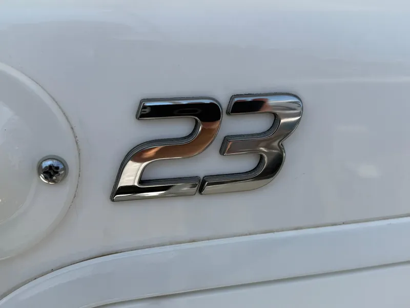 Slide: The Image of Chrome '23' emblem on 2018 Regulator boat exterior. - 30
