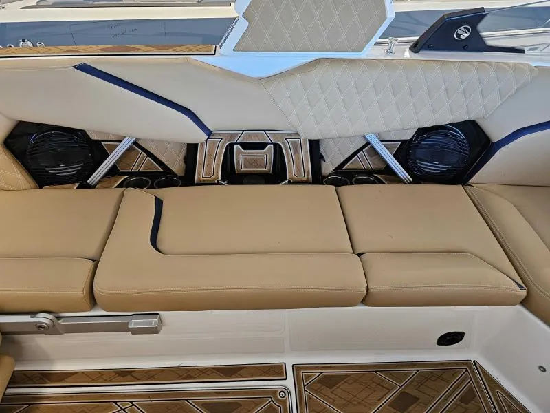 Slide: The Image of 2024 Tigé 24RZX boat interior with tan seating and stylish design elements. - 13