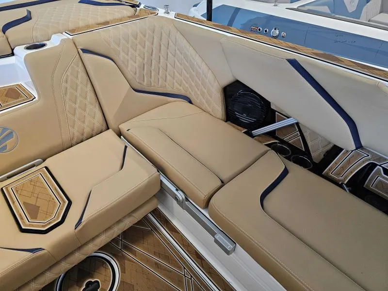 Slide: The Image of 2024 Tigé 24RZX boat interior with tan quilted seats and modern design accents. - 14