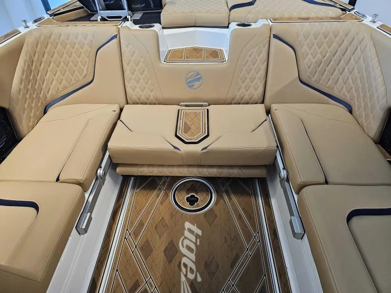 Slide: The Image of Luxurious interior of 2024 Tigé 24RZX boat with tan quilted seating and stylish flooring. - 15