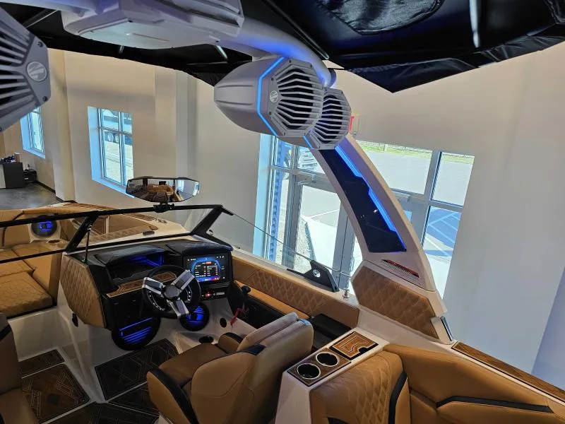Slide: The Image of 2024 Tigé 24RZX boat interior with advanced dashboard and premium seating. - 16