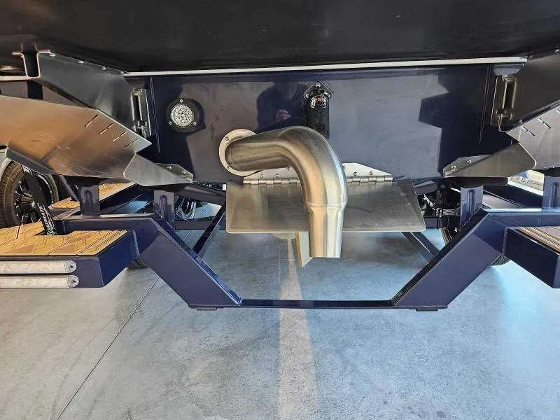 Slide: The Image of 2024 Tigé 24RZX boat underside showing exhaust and propeller guard. - 17