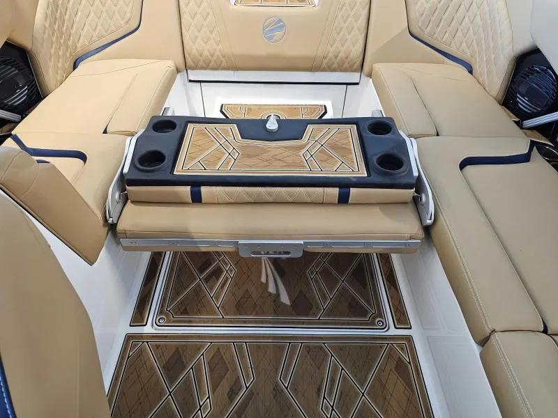Slide: The Image of 2024 Tigé 24RZX boat interior with tan seating and stylish flooring. - 18