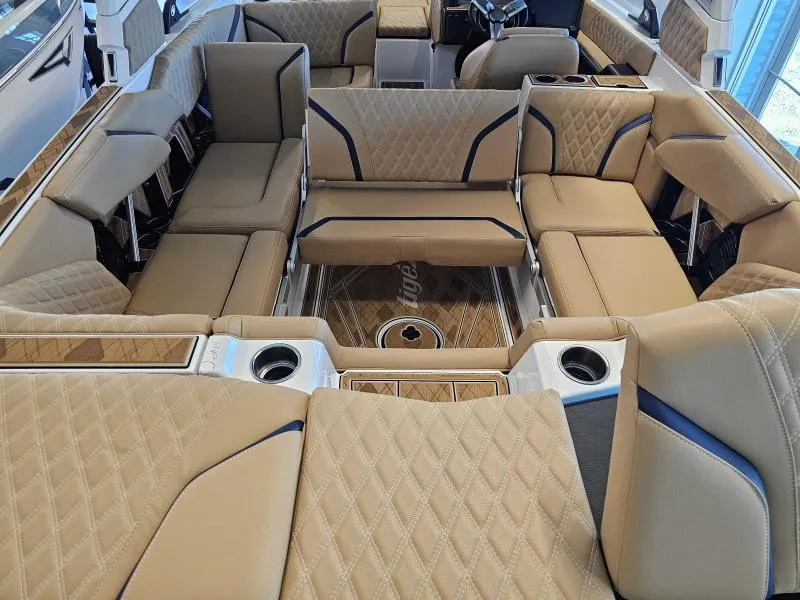 Slide: The Image of 2024 Tigé 24RZX boat interior with luxurious tan seating and cup holders. - 21