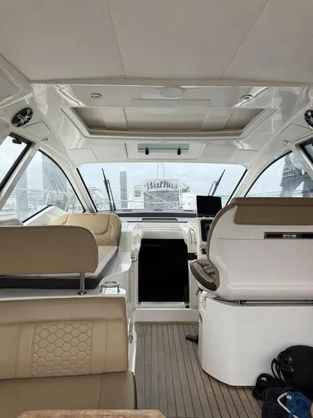 Slide: The Image of Interior of 2019 Sea Ray 350 Sundancer Coupe, featuring luxurious seating and modern design. - 36