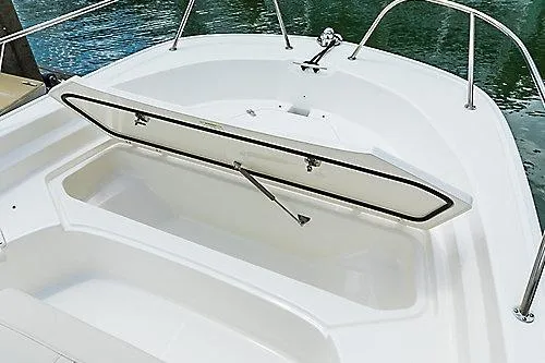 Slide: The Image of 2026 Boston Whaler 190 Montauk boat with open storage compartment on deck. - 3