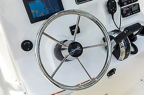 Slide: The Image of Steering wheel and controls of 2026 Boston Whaler 190 Montauk boat. - 4