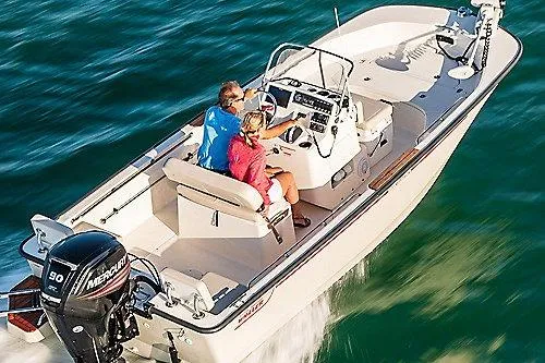 Slide: The Image of 2026 Boston Whaler 170 Montauk boat cruising on open water with two passengers. - 5