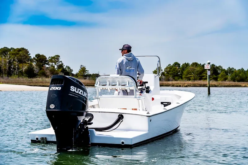 Slide: The Image of 1972 SeaCraft 20 Classic boat with Suzuki 200 outboard motor on calm water. - 2