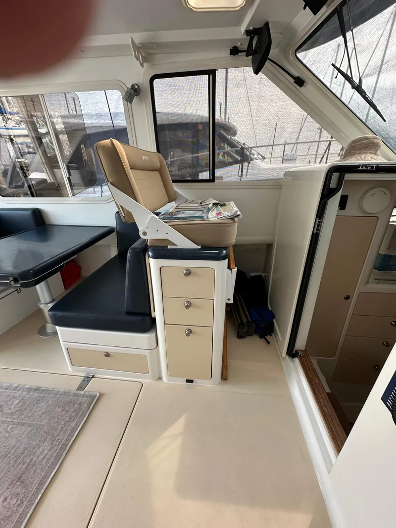 Slide: The Image of Interior of 2002 True North 38 boat with seating and storage. - 12