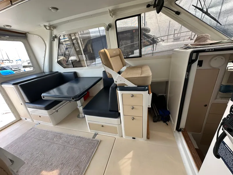 Slide: The Image of Interior of 2002 True North 38 boat with seating and navigation area. - 19