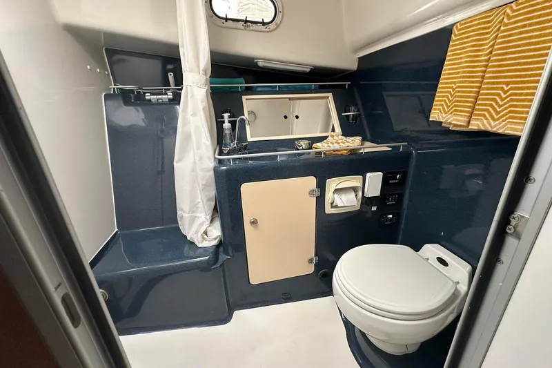 Slide: The Image of Bathroom interior of 2002 True North 38 yacht with toilet and sink. - 27