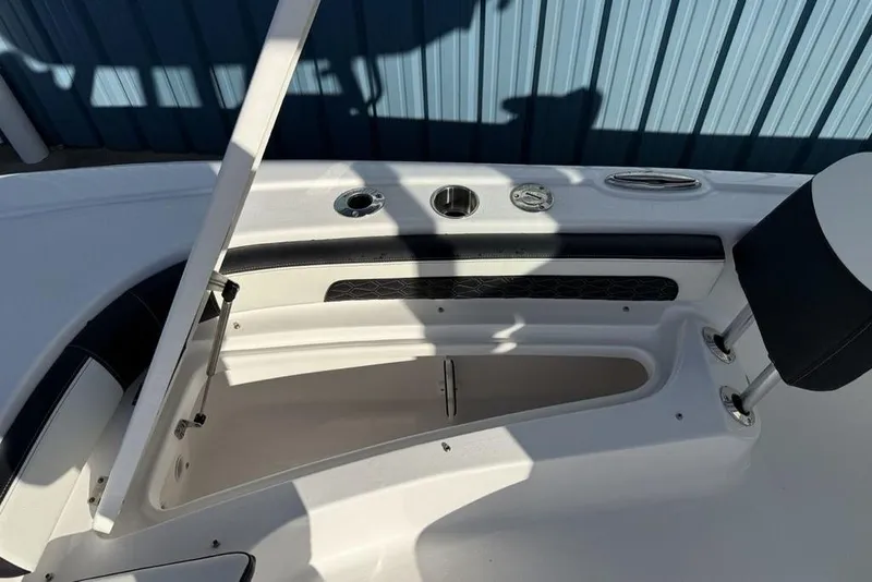 Slide: The Image of 2026 Tidewater 2300 Carolina Bay boat interior with open storage compartment. - 13