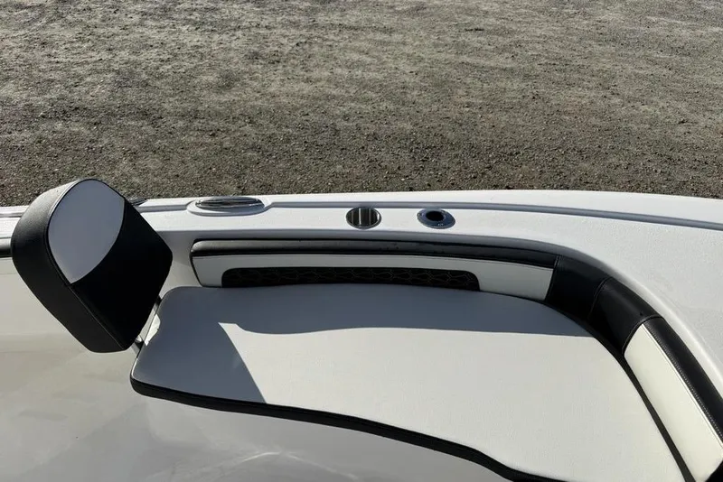 Slide: The Image of 2026 Tidewater 2300 Carolina Bay boat interior with sleek seating and cup holders. - 15