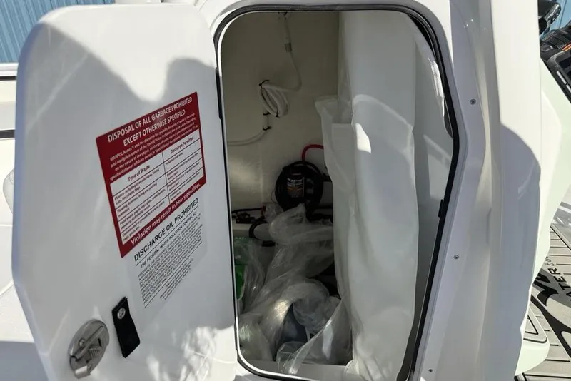 Slide: The Image of Open storage compartment on 2026 Tidewater 2300 Carolina Bay boat. - 19