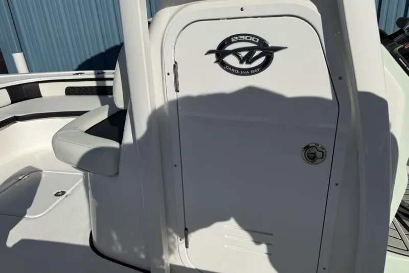 Slide: The Image of 2026 Tidewater 2300 Carolina Bay boat interior with seating and logo detail. - 20