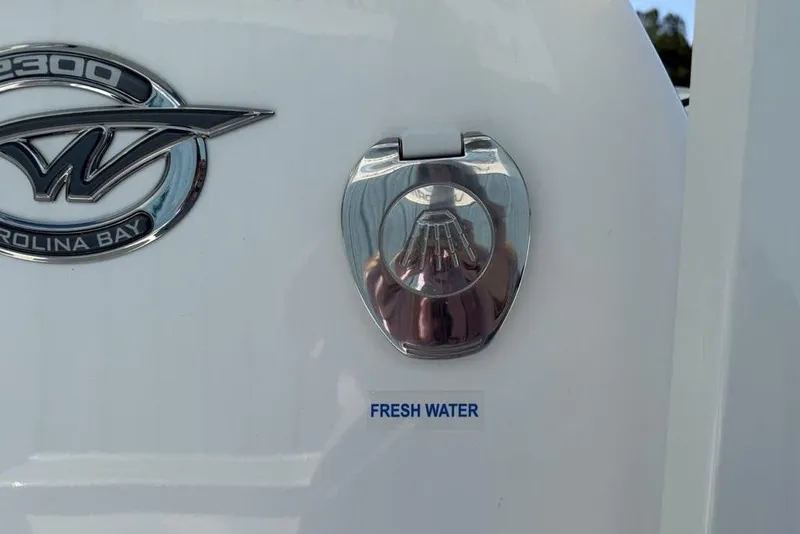 Slide: The Image of 2026 Tidewater 2300 Carolina Bay boat with fresh water access port. - 28