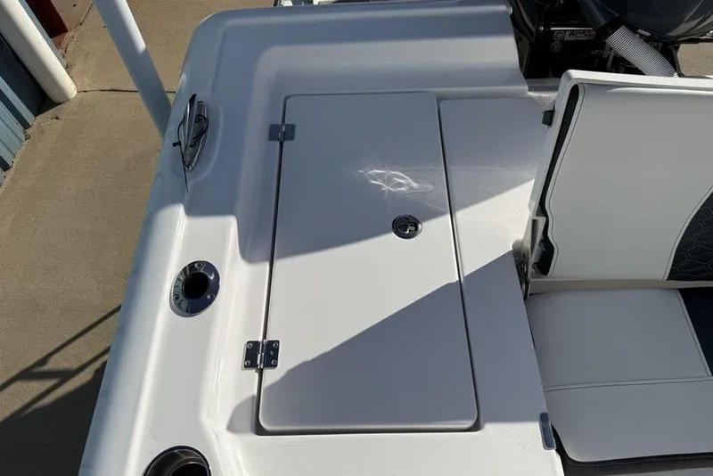 Slide: The Image of 2026 Tidewater 2300 Carolina Bay boat deck with storage compartment and seating. - 31