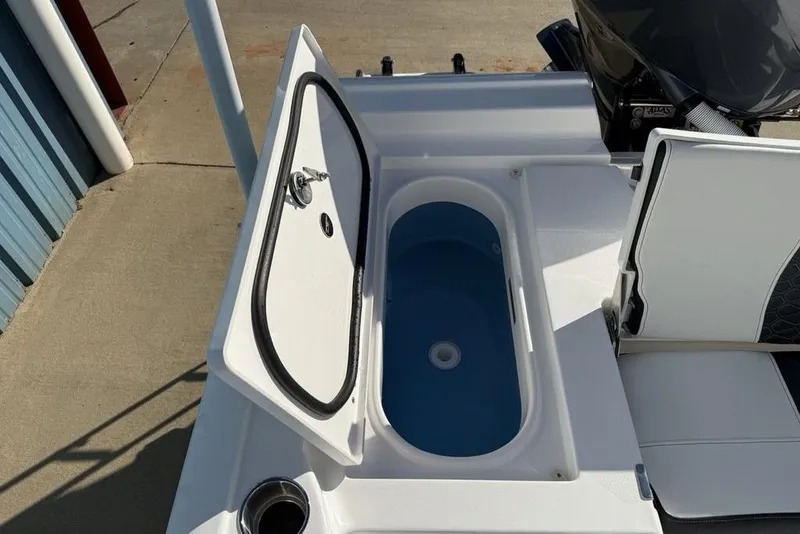 Slide: The Image of Livewell on 2026 Tidewater 2300 Carolina Bay boat, open lid, blue interior. - 37