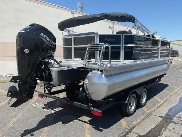 Slide: The Image of 2025 Sun Tracker Party Barge 20 DLX pontoon boat with Mercury outboard motor. - 2