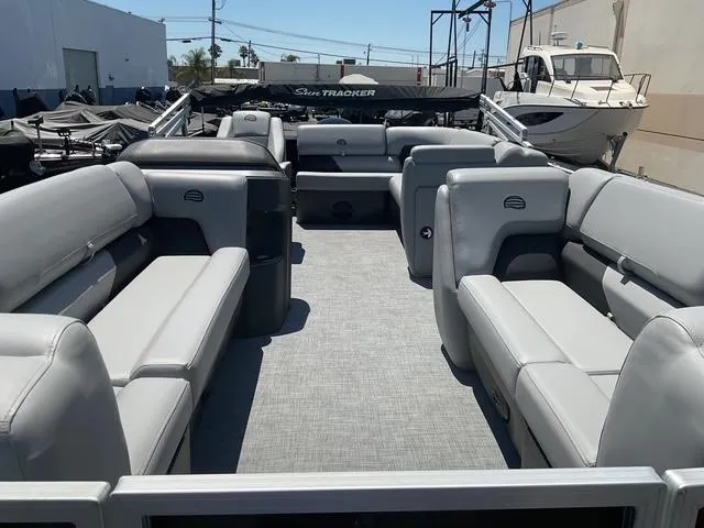 Slide: The Image of 2025 Sun Tracker Party Barge 20 DLX pontoon boat with spacious seating and modern design. - 8