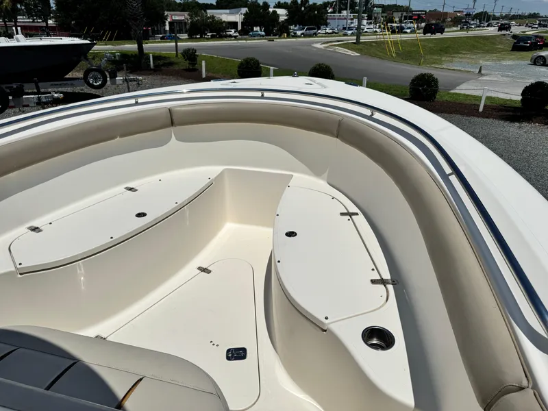 Slide: The Image of 2010 Pursuit C 280 Center Console boat interior with seating and storage compartments. - 10