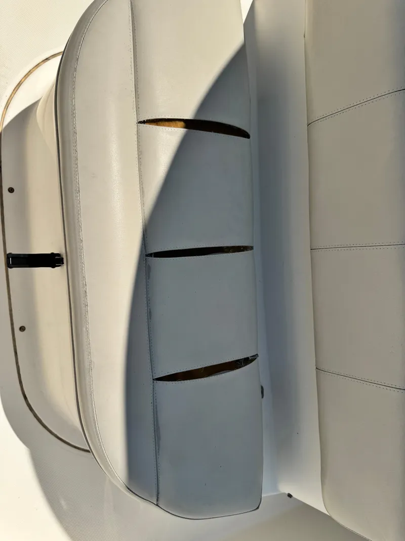 Slide: The Image of 2010 Pursuit C 280 Center Console boat seat, white leather upholstery. - 18