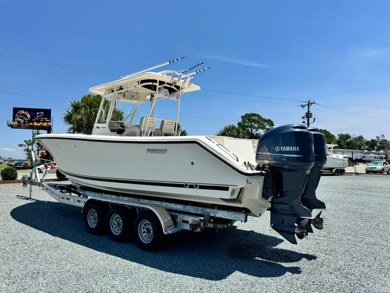 Slide: The Image of 2010 Pursuit C 280 Center Console boat on trailer with Yamaha outboard motor. - 4