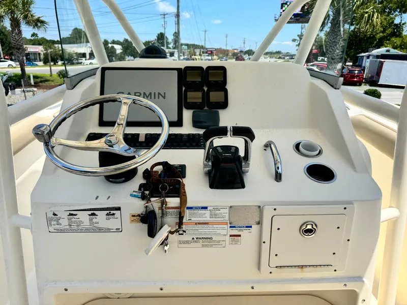 Slide: The Image of 2010 Pursuit C 280 Center Console boat dashboard with Garmin navigation system. - 9