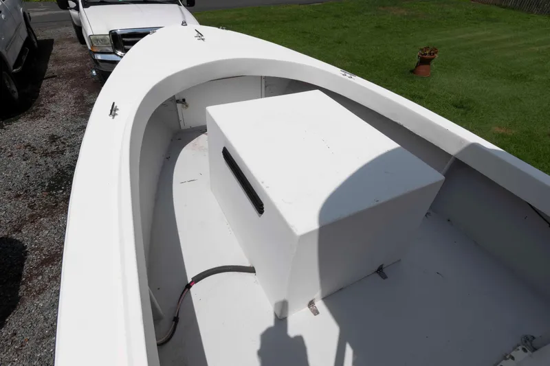 Slide: The Image of 1999 Custom High Seas Pumpout Boat with white deck and storage compartment. - 4