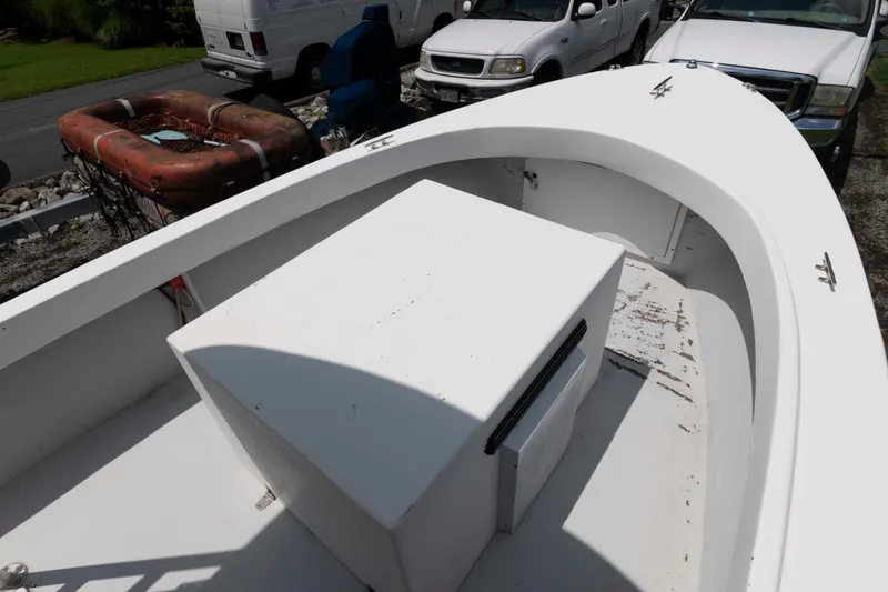 Slide: The Image of Custom 1999 High Seas Pumpout Boat with white deck and storage compartment. - 5