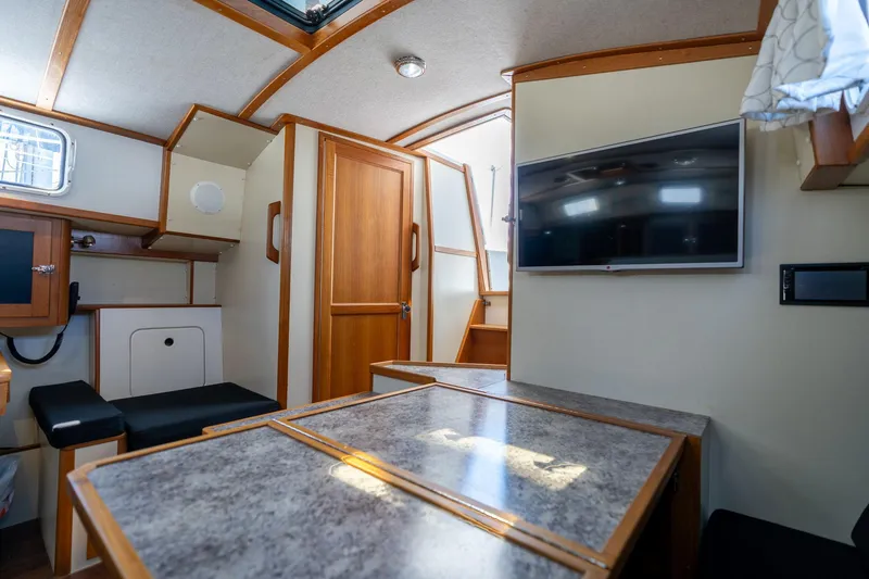 Slide: The Image of Interior of 1978 Cascade High Side boat with wood accents and modern amenities. - 13