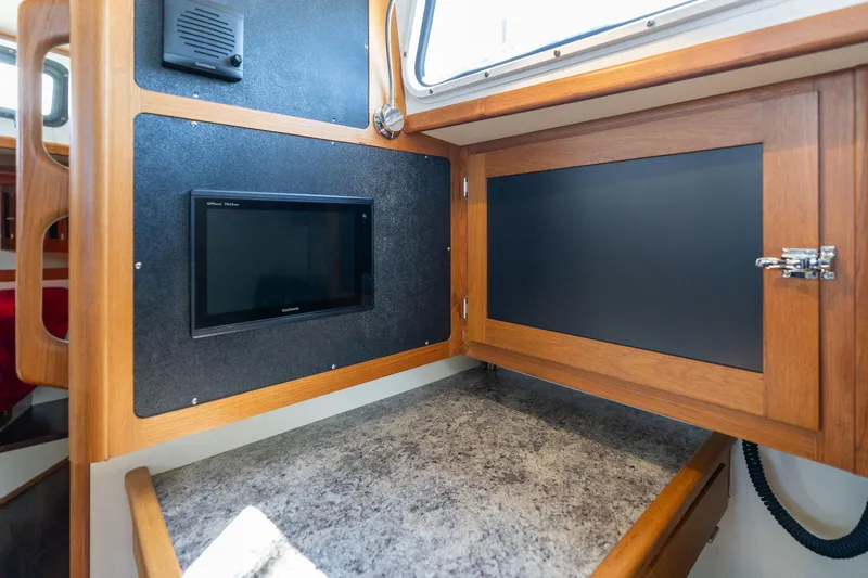 Slide: The Image of 1978 Cascade High Side interior with wood paneling and navigation equipment. - 30