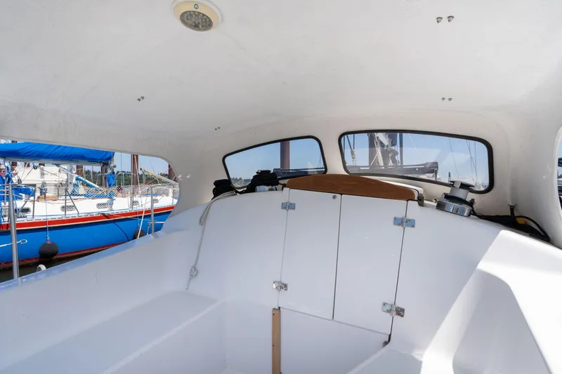 Slide: The Image of Interior view of a 1978 Cascade High Side boat with visible windows and storage compartments. - 33