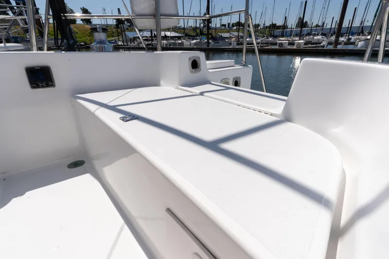 Slide: The Image of 1978 Cascade High Side boat deck with marina view, featuring clean white surfaces and railing. - 38