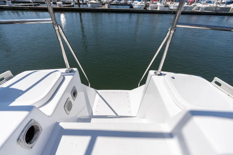 Slide: The Image of Stern view of 1978 Cascade High Side boat docked at marina. - 39