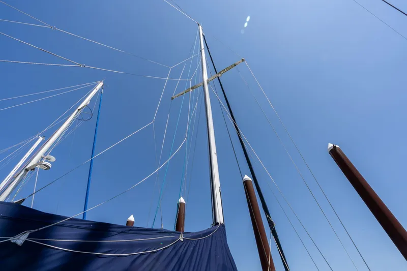 Slide: The Image of Sailboat masts and rigging against clear blue sky, Cascade Hign Side 1978 model. - 45