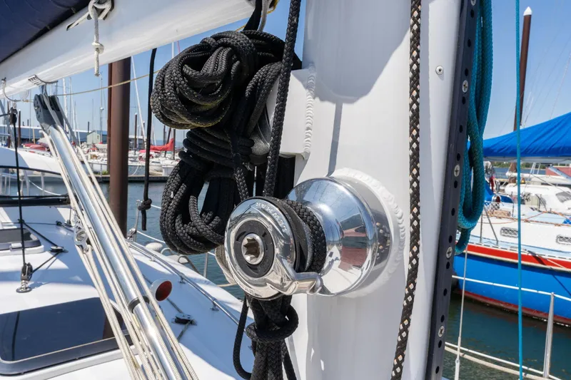Slide: The Image of Close-up of a 1978 Cascade High Side sailboat's rigging and winch at a marina. - 48