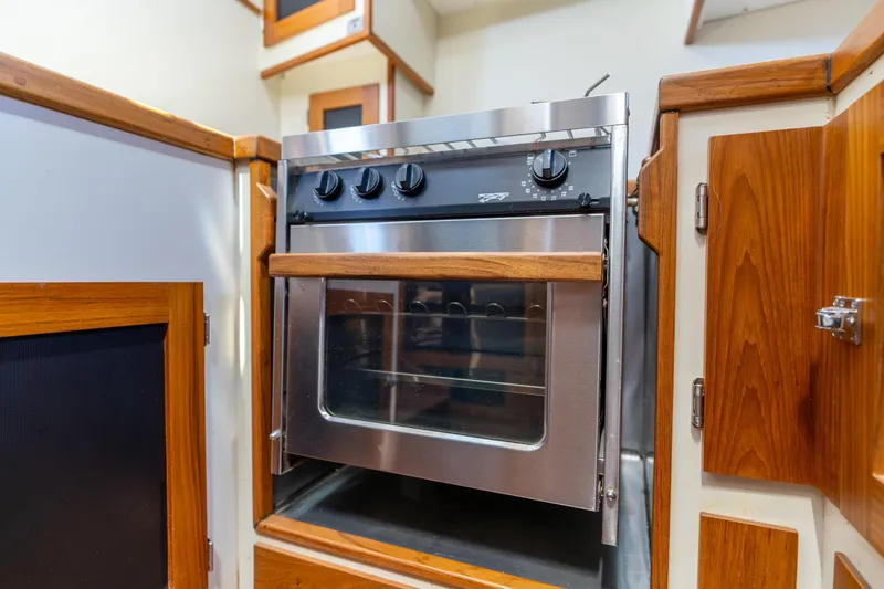 Slide: The Image of 1978 Cascade High Side oven in a wooden kitchen setting. - 22