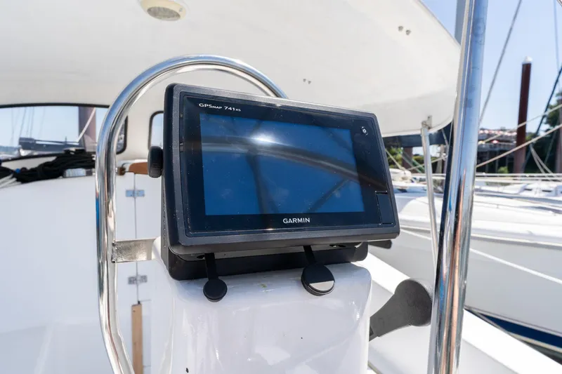 Slide: The Image of Garmin GPS device on 1978 Cascade High Side sailboat, docked in marina. - 37