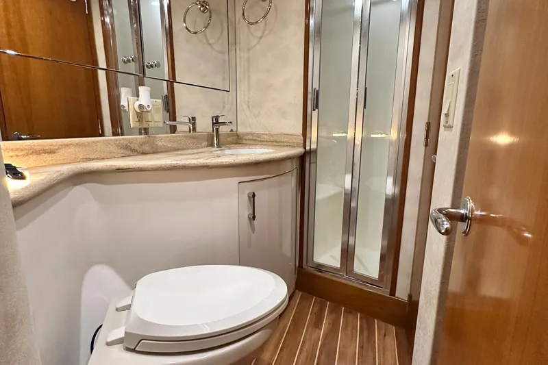 Slide: The Image of Luxurious bathroom in 2002 Hatteras 50 Convertible Sportfish yacht with modern fixtures. - 103