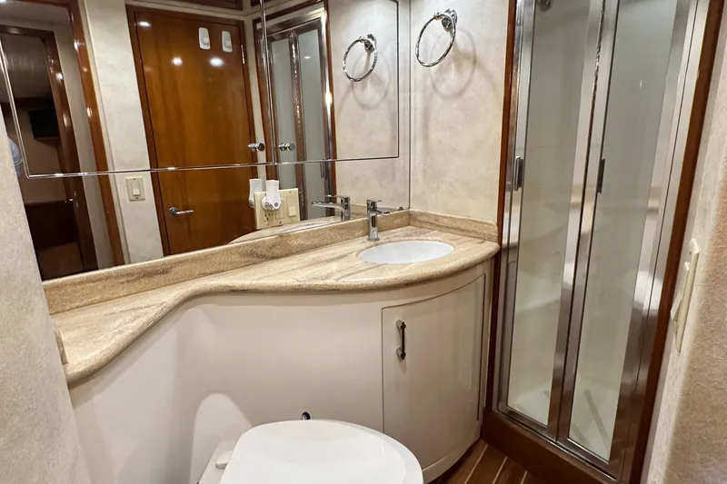 Slide: The Image of Luxurious bathroom in 2002 Hatteras 50 Convertible Sportfish yacht with shower and vanity. - 106