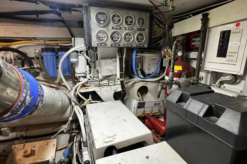 Slide: The Image of Engine room of 2002 Hatteras 50 Convertible Sportfish with gauges and wiring. - 112