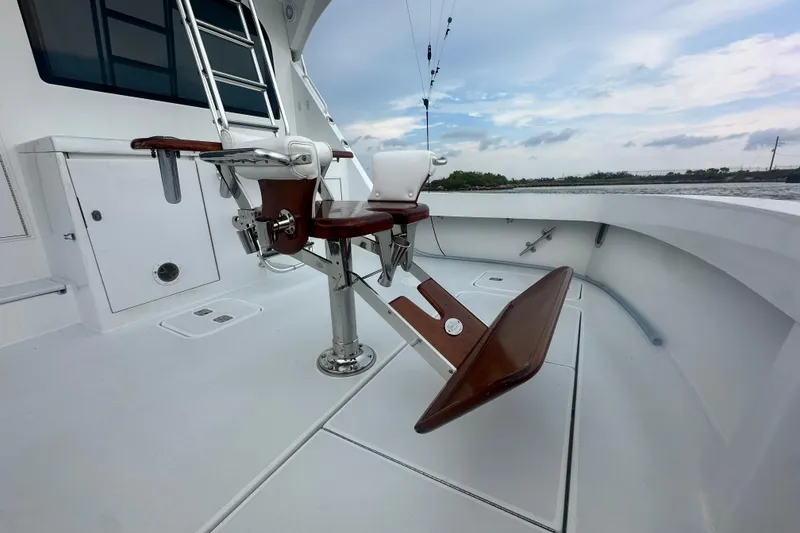 Slide: The Image of 2002 Hatteras 50 Convertible Sportfish boat deck with fishing chair and ocean view. - 17
