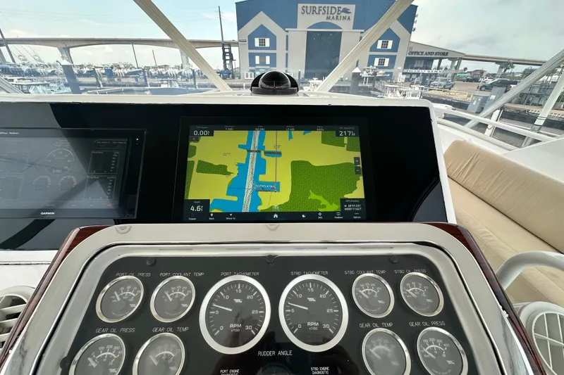 Slide: The Image of 2002 Hatteras 50 Convertible Sportfish dashboard with navigation and control gauges at Surfside Marina. - 33