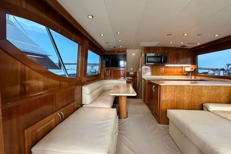 Slide: The Image of Luxurious interior of 2002 Hatteras 50 Convertible Sportfish yacht with wood finishes and modern amenities. - 48