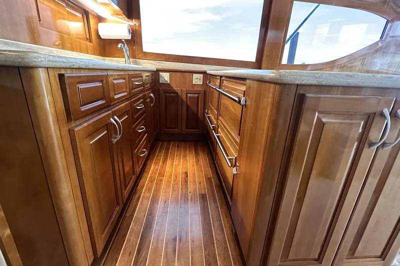Slide: The Image of Luxurious wooden interior of 2002 Hatteras 50 Convertible Sportfish yacht kitchen. - 59