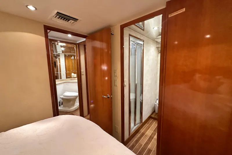 Slide: The Image of 2002 Hatteras 50 Convertible Sportfish interior with bathroom and wooden finishes. - 74