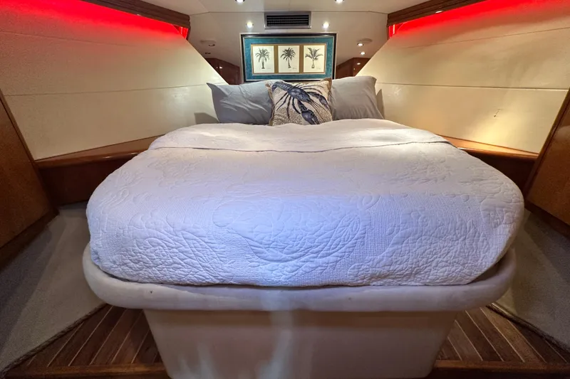 Slide: The Image of Luxurious cabin interior of 2002 Hatteras 50 Convertible Sportfish with cozy bedding. - 87